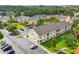 Aerial view of a community with multiple condo buildings, parking and landscaping at 2867 Club Cortile Cir, Kissimmee, FL 34746