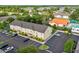 Aerial view of a well maintained condominium community with ample parking at 2867 Club Cortile Cir, Kissimmee, FL 34746