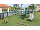 View of the community playground with climbing and sliding features at 2867 Club Cortile Cir, Kissimmee, FL 34746