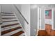 Staircase with inspiring quotes and nearby hardwood flooring leading to bedroom at 2867 Club Cortile Cir, Kissimmee, FL 34746