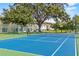 View of a tennis court in a well-maintained community at 2867 Club Cortile Cir, Kissimmee, FL 34746