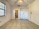 Bedroom featuring tile floors, natural light, and an en-suite bathroom, creating a private retreat at 430 Short Dr, Kissimmee, FL 34759