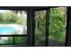 Balcony view showcasing the community pool area and lush tropical landscaping at 4378 Aqua Vista Dr # L, Orlando, FL 32839