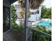 Balcony view showcasing the pool and trees at 4378 Aqua Vista Dr # L, Orlando, FL 32839