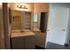 Bathroom vanity with storage and ample counter space, plus large mirror at 4378 Aqua Vista Dr # L, Orlando, FL 32839