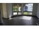 Bright living room with sleek tile flooring and large windows overlooking lush greenery at 4378 Aqua Vista Dr # L, Orlando, FL 32839