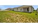 Spacious backyard with lush lawn and covered patio at 4501 Hummingbird Ln, Haines City, FL 33844
