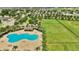 Aerial view of the community dog park with green space, play area, and seating at 4501 Hummingbird Ln, Haines City, FL 33844