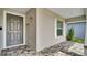 Stylish front door with decorative accents and a tiled entryway at 4501 Hummingbird Ln, Haines City, FL 33844