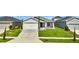 Beautiful single-story home with a manicured lawn and a two car garage at 4501 Hummingbird Ln, Haines City, FL 33844