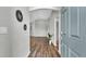 Open foyer with beautiful wood floors and views into the living areas at 4501 Hummingbird Ln, Haines City, FL 33844