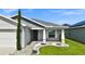 Inviting front porch features stylish stone landscaping and a covered entrance at 4501 Hummingbird Ln, Haines City, FL 33844