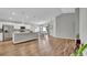 Spacious living room with hardwood floors, kitchen view, and dining area at 4501 Hummingbird Ln, Haines City, FL 33844