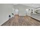 Open-concept living room with hard wood floors, neutral paint, and lots of natural light at 4501 Hummingbird Ln, Haines City, FL 33844
