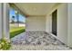 Cozy covered patio with stylish tile flooring and decorative plants at 4501 Hummingbird Ln, Haines City, FL 33844