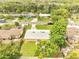An aerial view of a charming single-Gathering home with a well-kept lawn and a newly installed roof at 4521 Alrix Dr, Orlando, FL 32839