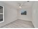 Bedroom features wood-look flooring, a ceiling fan, and a window with natural light at 4521 Alrix Dr, Orlando, FL 32839