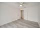 Bright bedroom features a ceiling fan, light-colored walls, and light gray wood-look flooring at 4521 Alrix Dr, Orlando, FL 32839