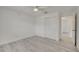 Well-lit bedroom showcases wood-look flooring, a ceiling fan, and a closet for storage at 4521 Alrix Dr, Orlando, FL 32839