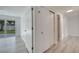 Bedroom with access to closet and ensuite featuring light gray wood-look floors and light-colored walls at 4521 Alrix Dr, Orlando, FL 32839