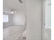 Open living room featuring a ceiling fan and light gray wood-look floors at 4521 Alrix Dr, Orlando, FL 32839