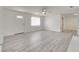 Open-concept living area with a front door view, light gray flooring, and a ceiling fan at 4521 Alrix Dr, Orlando, FL 32839
