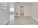 The entry to a living room with light gray flooring, neutral walls, and views to other rooms at 4521 Alrix Dr, Orlando, FL 32839