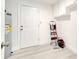 A utility room features clean flooring, a water heater, storage cabinets, and access to the exterior at 4521 Alrix Dr, Orlando, FL 32839