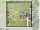 Drone shot of the property showcasing the expansive lot, screened pool, and outbuildings at 4551 Hunting Lodge Dr, St Cloud, FL 34772
