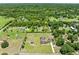 Lush acreage with a meticulously maintained home, screened pool, and mature landscaping at 4551 Hunting Lodge Dr, St Cloud, FL 34772