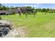 Sprawling backyard featuring a screened pool, mature trees, and lush landscaping at 4551 Hunting Lodge Dr, St Cloud, FL 34772