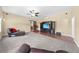 Open concept bonus room featuring access to the kitchen, television and comfortable seating at 4551 Hunting Lodge Dr, St Cloud, FL 34772