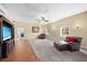 Spacious bonus room with a ceiling fan, large windows, and plush carpeting at 4551 Hunting Lodge Dr, St Cloud, FL 34772