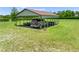 View of a covered carport with an SUV parked underneath, providing vehicle protection and convenient outdoor storage at 4551 Hunting Lodge Dr, St Cloud, FL 34772