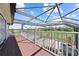 This wooden deck overlooks the pool and the expansive lawn, creating a beautiful outdoor living space at 4551 Hunting Lodge Dr, St Cloud, FL 34772