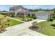 Long driveway leading to a well-maintained home with an attached two-car garage at 4551 Hunting Lodge Dr, St Cloud, FL 34772