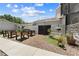 Exterior with garden beds, seating area, privacy fence, and meticulous landscaping at 4551 Hunting Lodge Dr, St Cloud, FL 34772