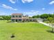 Charming two-story home with a welcoming front porch and beautifully landscaped front yard at 4551 Hunting Lodge Dr, St Cloud, FL 34772