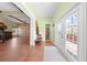 Foyer featuring hardwood floors, exposed beams, stone accents, and patio access at 4551 Hunting Lodge Dr, St Cloud, FL 34772