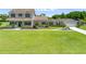 Charming two-story home with a welcoming front porch and lush green lawn at 4551 Hunting Lodge Dr, St Cloud, FL 34772