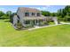 Beautiful two-story home showcasing a spacious lawn and charming front porch at 4551 Hunting Lodge Dr, St Cloud, FL 34772