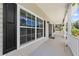 Inviting front porch featuring black shutters and double doors, perfect for enjoying the outdoors at 4551 Hunting Lodge Dr, St Cloud, FL 34772