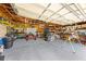 Well-organized garage featuring workbenches and tool storage, perfect for DIY projects at 4551 Hunting Lodge Dr, St Cloud, FL 34772