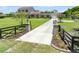 Private gated entrance to a serene property with a long driveway and manicured landscaping at 4551 Hunting Lodge Dr, St Cloud, FL 34772