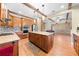 Open-concept kitchen with island, stainless steel appliances, and seamless flow into the living area at 4551 Hunting Lodge Dr, St Cloud, FL 34772
