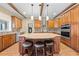 Elegant kitchen showcasing a center island with stool seating, perfect for Gathering gatherings and entertaining at 4551 Hunting Lodge Dr, St Cloud, FL 34772