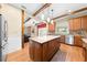 Beautiful kitchen with a large island, stainless appliances, granite countertops and views to the living room at 4551 Hunting Lodge Dr, St Cloud, FL 34772