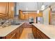 Chef's kitchen with high-end appliances, wooden cabinets, and a stylish range hood at 4551 Hunting Lodge Dr, St Cloud, FL 34772