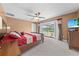 Bright main bedroom with access to a screened balcony and a ceiling fan at 4551 Hunting Lodge Dr, St Cloud, FL 34772
