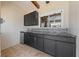 This is a detail shot of the lovely outdoor kitchen featuring sleek countertops and custom cabinets at 4551 Hunting Lodge Dr, St Cloud, FL 34772